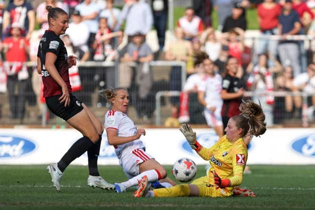 Julia Stierli of SC Freiburg, Pauline Bremer of 1. FC Köln, and goalkeeper Anna Reimann of SC Freiburg in a tackle during the Women s Bundesliga match between 1. FC Köln and SC Freiburg, Franz Kremer Stadium on October 3, 2026, in Cologne, Germany. Photo by Oliver Kaelke, DeFodi Images. Julia Stierli of SC Freiburg, Pauline Bremer of 1. FC Köln and goalkeeper Anna Reimann of SC Freiburg battle for the ball during the Bundesliga match between 1. FC Köln and SC Freiburg at Franz Kremer Stadium on October 3, 2026 in Cologne, Germany. Photo by Oliver Kaelke, DeFodi Images. DFB and DFL regulations prohibit any use of photographs as image sequences and or quasi-video. Photo by Oliver Kaelke, DeFodi Images.