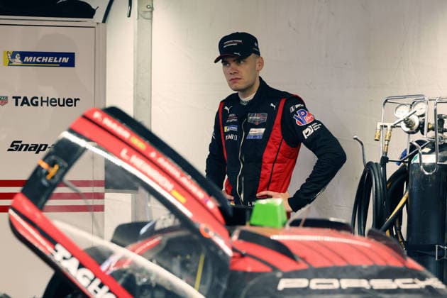 A frustrated Laurin Heinrich (GER) stands behind the heavily damaged Porsche 963 No. 7 in the Porsche Penske tent at the 29th Motul Petit Le Mans race of the IMSA racing series at Road Atlanta, Georgia, USA, on October 3, 2026. Accident, retirement