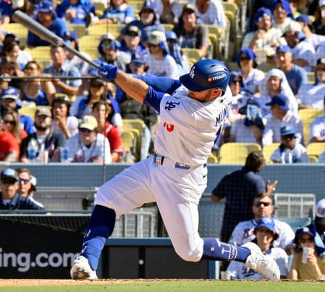 Los Angeles Dodgers Max Muncy hits a solo home run in the sixth inning against the Atlanta Braves in game one of the National League Division Series at Dodger Stadium on Saturday, October 3, 2026 in Los Angeles, California. The Dodgers defeated the Braves 5-3.  LAP20261003806 JIMxRUYMEN