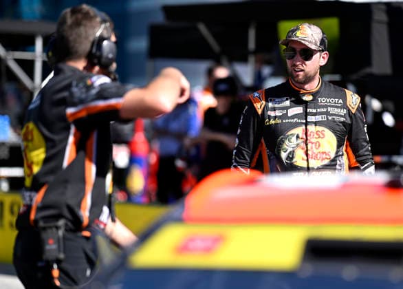 LAS VEGAS, NV - OCTOBER 03: Chase Briscoe ( 19 Joe Gibbs Racing Bass Pro Shops Toyota) stands in his pit while speaking with a crew member following practice for the NASCAR, Motorsport, USA Cup Series Playoffs South Point 400 race at Las Vegas Motor Speedway Saturday Oct. 3, 2026 in Las Vegas, Nevada. (Photo by Will Lester Icon Sportswire) AUTO: OCT 03 NASCAR Cup Series Playoffs South Point 400 EDITORIAL USE ONLY Icon26100311812