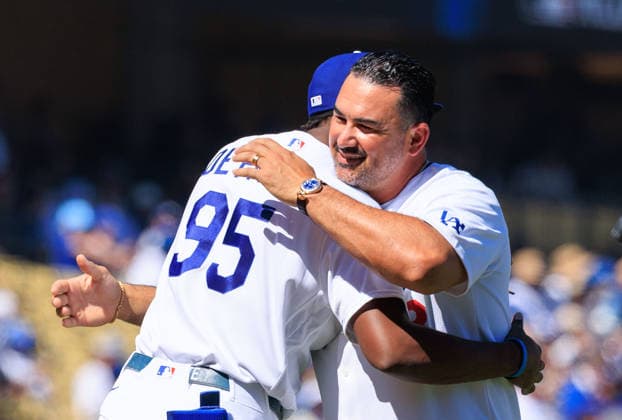 October 3, 2026, Los Angeles, California, USA: Former Dodgers first baseman AdrioÂ¡n GonzoÂ¡lez hugs Josuo De Paula 95, who caught GonzoÂ¡lezÃ¢â‚¬â ¢s ceremonial first pitch before NLDS Game 1 between the Los Angeles Dodgers and the Atlanta Braves on Saturday, October 3, 2026, at Dodger Stadium in Los Angeles, California. JAVIER ROJAS PI Los Angeles USA - ZUMAp124 20261003_zaa_p124_040 Copyright: xJavierxRojasx