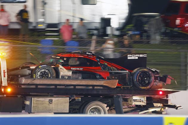 The Porsche 963 No. 7 driven by Felipe Nasr, Laurin Heinrich, and Julien Andlauer, which was severely damaged in an accident, on a tow truck; IMSA racing series, 29th Motul Petit Le Mans race, Road Atlanta, Georgia, USA, October 3, 2026; retirement; removal