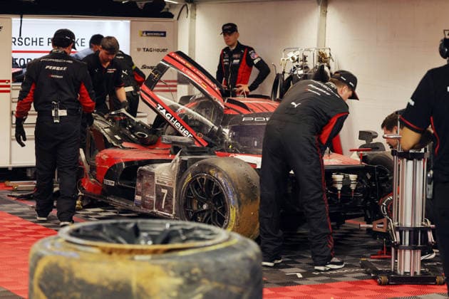 Mechanics are working on the Porsche 963 No. 7, which was severely damaged in an accident; Felipe Nasr, Laurin Heinrich, Julien Andlauer; Porsche Penske tent; IMSA racing series; 29th Motul Petit Le Mans race; Road Atlanta, Georgia, USA; October 3, 2026, Retired,