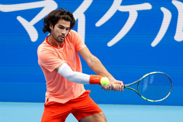 October 4, 2026, Tokyo, Japan: Carlos Alcaraz (Spain) returns a shot against Denis Shapovalov (Canada) during their quarterfinal match at the Kinoshita Group Japan Open Tennis Championships at Ariake Colosseum in Tokyo. Shapovalov suffered an injury, forcing him to retire early in the second set. The tournament runs from September 29 to October 6. Alcaraz won 7-6(3), 2-1 Tokyo Japan - ZUMAm191 20261004_aap_m191_059 Copyright: xRodrigoxReyesxMarinx