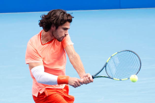 October 4, 2026, Tokyo, Japan: Carlos Alcaraz (Spain) returns a shot against Denis Shapovalov (Canada) during their quarterfinal match at the Kinoshita Group Japan Open Tennis Championships at Ariake Colosseum in Tokyo. Shapovalov suffered an injury, forcing him to retire early in the second set. The tournament runs from September 29 to October 6. Alcaraz won 7-6(3), 2-1 Tokyo Japan - ZUMAm191 20261004_aap_m191_055 Copyright: xRodrigoxReyesxMarinx