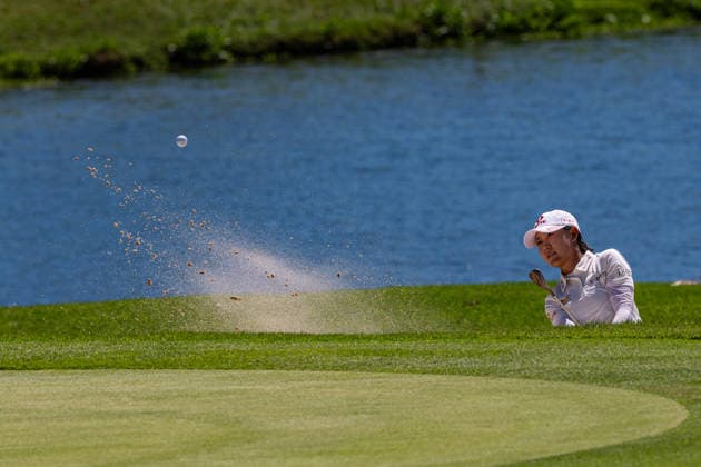 October 3, 2026, Honolulu, Hawaii, USA: YOUMIN HWANG makes a chip shot from the bunker at the 7th green during Round 3 of the 2026 Lotte Championship at Hoakalei Country Club, Ewa Beach, Hawaii, USA. Honolulu USA - ZUMAm310 20261003_zsp_m310_007 Copyright: xElliotxMilesx