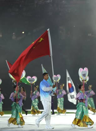 (261004) -- NAGOYA, Oct. 4, 2026 -- Flag-bearer of the delegation of China Bi Kun parades into the stadium during the closing ceremony of the 20th Asian Games Aichi-Nagoya 2026 in Nagoya, Japan, Oct. 4, 2026. ) (SP)JAPAN-NAGOYA-ASIAN GAMES-CLOSING CEREMONY JiaxHaocheng