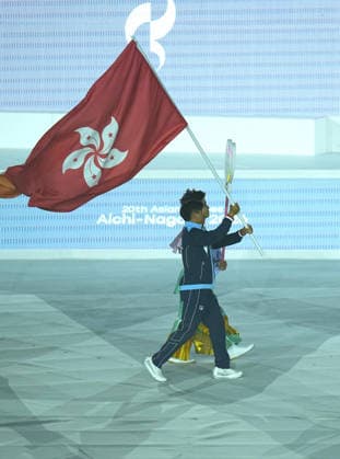 (261004) -- NAGOYA, Oct. 4, 2026 -- Flag-bearer of the delegation of Hong Kong of China parades into the stadium during the closing ceremony of the 20th Asian Games Aichi-Nagoya 2026 in Nagoya, Japan, Oct. 4, 2026. ) (SP)JAPAN-NAGOYA-ASIAN GAMES-CLOSING CEREMONY CheongxKamxKa 