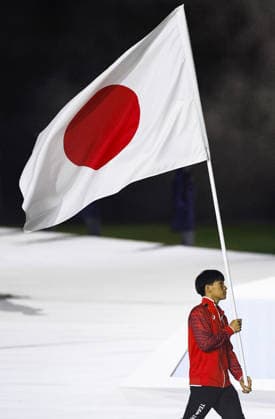 Aichi-Nagoya Asian Games: Closing ceremony Japanese swimmer Shin Ohashi carries the Japanese flag during the closing ceremony of the Aichi-Nagoya Asian Games at Mizuho Park Athletic Stadium in Nagoya, central Japan, on Oct. 4, 2026. A14AA0005629998P
