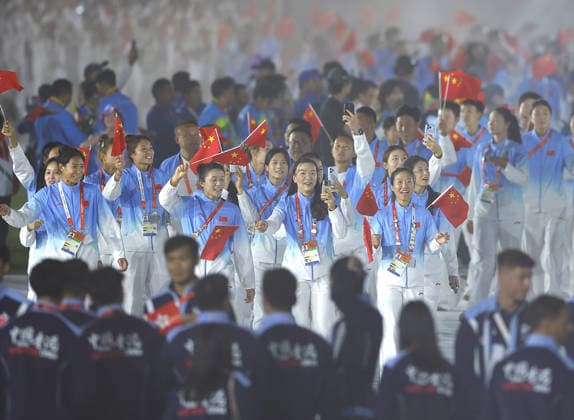 (261004) -- NAGOYA, Oct. 4, 2026 -- The delegation of China parade into the stadium during the closing ceremony of the 20th Asian Games Aichi-Nagoya 2026 in Nagoya, Japan, Oct. 4, 2026. ) (SP)JAPAN-NAGOYA-ASIAN GAMES-CLOSING CEREMONY WuxZhizun