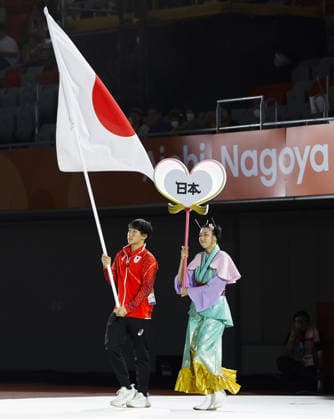 Aichi-Nagoya Asian Games: Closing ceremony Japanese swimmer Shin Ohashi carries the Japanese flag during the closing ceremony of the Aichi-Nagoya Asian Games at Mizuho Park Athletic Stadium in Nagoya, central Japan, on Oct. 4, 2026. A14AA0005630003P