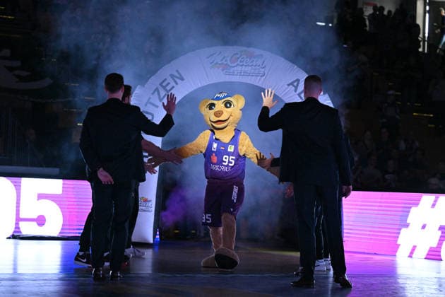 BG Göttingen vs. SBB Börde Baskets Wolmirstedt, October 4, 2026, Göttingen Basketball 2nd Bundesliga, ProA, BG Göttingen vs. SBB Börde Baskets Wolmirstedt, Matchday 3, Sparkassen Arena: The mascot runs through a cloud of smoke and high-fives people along the sidelines in Göttingen, Lower Saxony, Germany