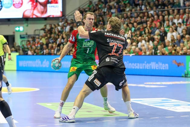 October 4, 2026, xgox, Handball: Opel HBL SC Magdeburg vs. HC Erlangen emspor, from left: Felix Claar (Magdeburg), 7; Maciej Gebala (Erlangen), 77; duel, battle, tackle, Magdeburg