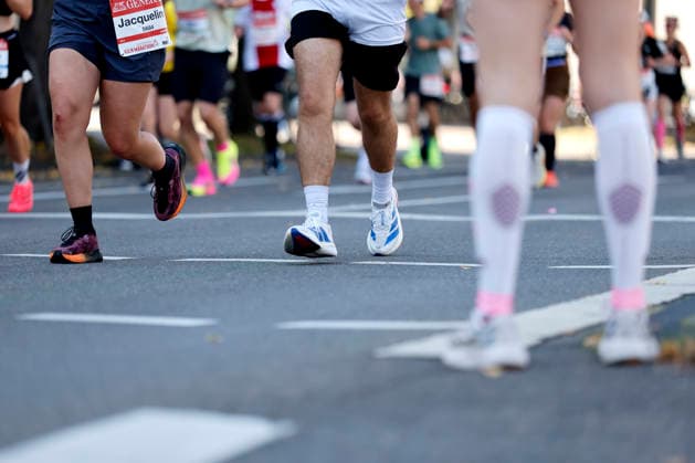 Participants in the 28th Generali Cologne Marathon 2026 run through downtown Cologne. Numerous spectators cheer on the runners with homemade signs. Thematic photo, symbolic image. Cologne, October 4, 2026. North Rhine-Westphalia, Germany Copyright: xChristophxHardtx