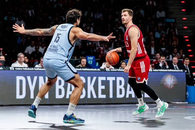 easyCredit Basketball Bundesliga FC Bayern Munich vs. EWE Baskets Oldenburg, October 4, 2026; Andreas Andi Obst of FC Bayern Munich, No. 13, with the ball against Marcel Keßen of EWE Baskets Oldenburg, No. 15; easyCredit Basketball Bundesliga FC Bayern Munich vs. EWE Baskets Oldenburg, Munich, BMW Park on October 4, 2026 Copyright: xBEAUTIFULxSPORTS Wunderlx