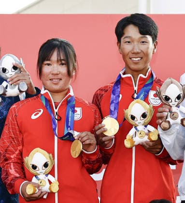 Aichi-Nagoya Asian Games: Sailing Japanese sailors Riho Sanematsu (L) and Misaki Tsunomori pose after winning the Aichi-Nagoya Asian Games youth mixed dinghy gold at Kaiyoh Yacht Harbor in Gamagori in Aichi Prefecture, central Japan, on Oct. 3, 2026.  A14AA0005630110P