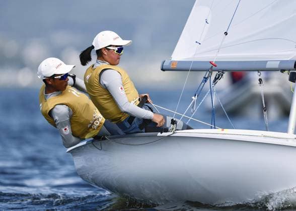 Aichi-Nagoya Asian Games: Sailing Japanese sailors Riho Sanematsu (R) and Misaki Tsunomori compete en route to winning the Aichi-Nagoya Asian Games youth mixed dinghy gold off Kaiyoh Yacht Harbor in Gamagori in Aichi Prefecture, central Japan, on Oct. 3, 2026.  A14AA0005630112P