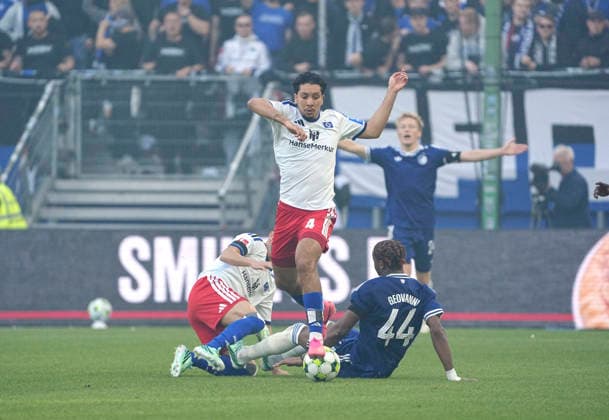 Photo: Bilal NADIR (HSV) and, on the left, Nicolas CAPALDO against Geovanni Vianney NDJEE. Bundesliga soccer, friendly match on Sunday, October 4, 2026. Hamburger SV vs. FC Copenhagen