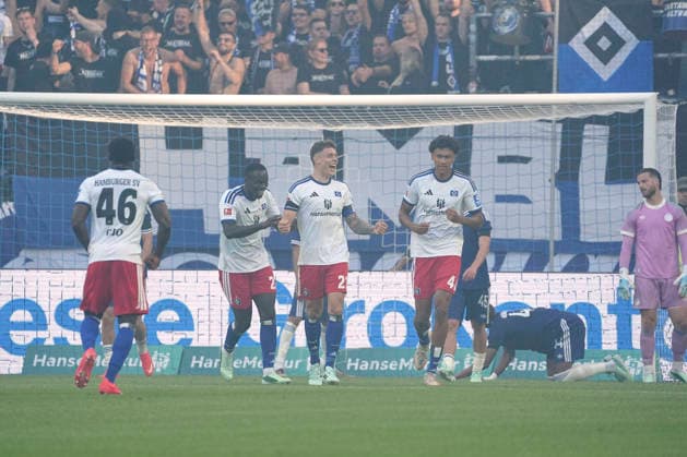 Photo: HSV players celebrate a goal after Nicolai REMBERG s 2-0 strike; Kofi AMOAKO and Bilal YALCINKAYA congratulate him. Bundesliga, friendly match on Sunday, October 4, 2026: Hamburger SV vs. FC Copenhagen