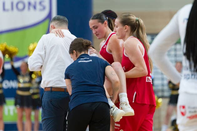 Nicole Brochlitz of the Lions, 6, is carried off the court injured during the Lions vs. TK Hannover Luchse game, women s basketball, 1st Bundesliga, DBBL, Matchday 1 of the 2026–27 season, April 10, 2026, at the SWH Arena in Saxony-Anhalt, Germany