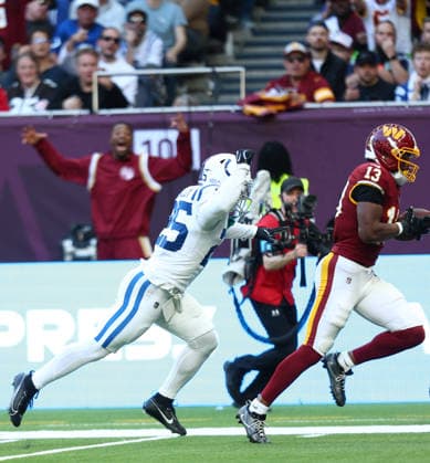 October 4, 2026, London, England, United Kingdom: TREYLON BURKS 13 of Washington Commanders scores a touchdown after a 47 yards pass from Athan Kaliakmanis in the NFL, American Football Herren, USA 2026 27 regular season game week 4 between INDIANAPOLIS COLTS and WASHINGTON COMMANDERS at the Tottenham Hotspur Stadium in London, United Kingdom. Colts won 30:13 against Commanders. NFL 2026: Colts 30:13 Commanders  - ZUMAc179 20261004_zep_c179_072 Copyright: xMickaelxChavetx