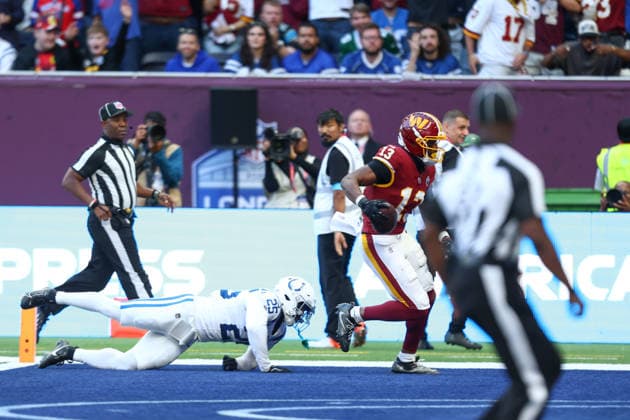 October 4, 2026, London, England, United Kingdom: TREYLON BURKS 13 of Washington Commanders scores a touchdown after a 47 yards pass from Athan Kaliakmanis in the NFL, American Football Herren, USA 2026 27 regular season game week 4 between INDIANAPOLIS COLTS and WASHINGTON COMMANDERS at the Tottenham Hotspur Stadium in London, United Kingdom. Colts won 30:13 against Commanders. London United Kingdom - ZUMAc179 20261004_zep_c179_070 Copyright: xMickaelxChavetx