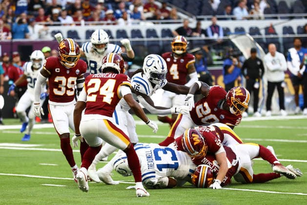 October 4, 2026, London, England, United Kingdom: LAQUON TREADWELL 13 of Indianapolis Colts is tackled by AMIK ROBERTSON 2 of Washington Commanders in the NFL, American Football Herren, USA 2026 27 regular season game week 4 between INDIANAPOLIS COLTS and WASHINGTON COMMANDERS at the Tottenham Hotspur Stadium in London, United Kingdom. Colts won 30:13 against Commanders. London United Kingdom - ZUMAc179 20261004_zep_c179_169 Copyright: xMickaelxChavetx