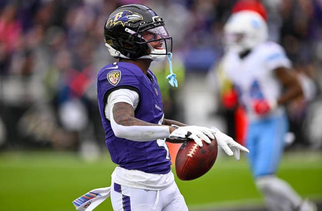 Baltimore Ravens wide receiver Zay Flowers (4) scores a touchdown after a 19 yard pass reception against the Tennessee Titans during the second quarter at M&T Bank Stadium in Baltimore, Maryland, on Sunday, October 4, 2026.  BAL20261004102 DAVIDxTULIS