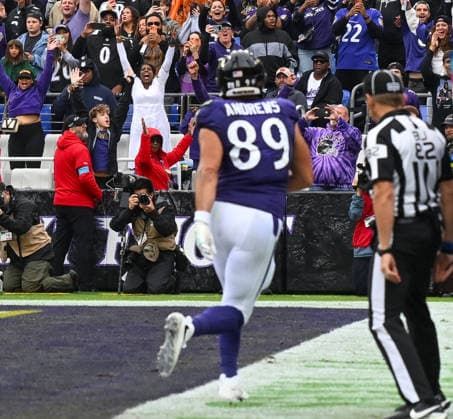 Baltimore Ravens fans react after tight end Mark Andrews (89) scores on a 3 yard pass against the Tennessee Titans during the second quarter of a game against the Tennessee Titans at M&T Bank Stadium in Baltimore, Maryland, on Sunday, October 4, 2026.  BAL20261004112 DAVIDxTULIS
