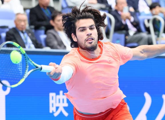 October 4, 2026, Tokyo, Japan - Carlos Alcaraz of Spain returns the ball against Denis Shapovalov of Canada during the quarter-final match of the Japan Open tennis championships at the Ariake Colosseum in Tokyo on Sunday, October 4, 2026. Shapovalov gave up the game in the middle and alcaraz advanced to the semi-final 7-6, 6-1. (photo by Yoshio Tsunoda AFLO) Noxthirdxpartyxsales 0868518523st YoshioxTsunodax