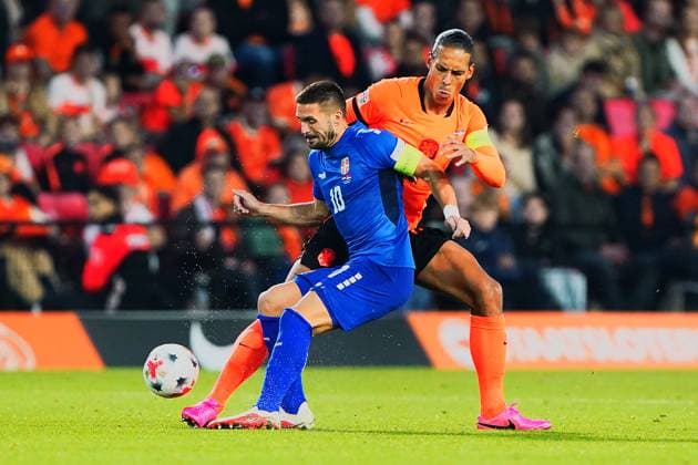 2026-10-04 UEFA Nations League: Netherlands v Serbia EINDHOVEN, NETHERLANDS - OCTOBER 4: Dusan Tadic of NEC Nijmegen and Virgil van Dijk of the Netherlands during the UEFA Nations League match between Netherlands and Serbia at Philips Stadion on October 4, 2026 in Eindhoven, Netherlands. Eindhoven Philips Stadion Netherlands Content not available for redistribution in The Netherlands directly or indirectly through any third parties. Copyright: xAndrexWeeningx