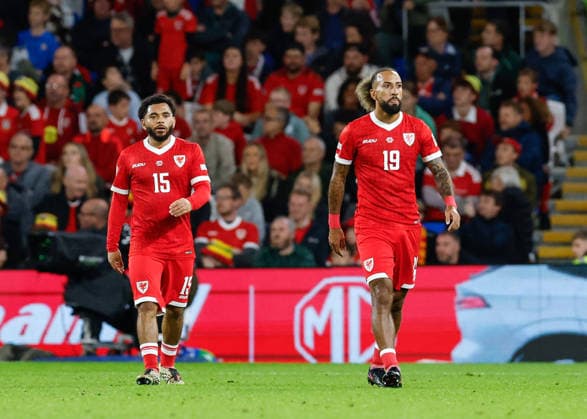 Cardiff, Wales, 4th October 2026. Jay Dasilva (left) and Sorba Thomas (right) of Wales react after their side concedes there first goal during the Wales vs Denmark UEFA Nations League match at the Cardiff City Stadium, Cardiff. Picture credit should read: Cody Froggatt Sportimage EDITORIAL USE ONLY. No use with unauthorised audio, video, data, fixture lists, club league logos or live services. Online in-match use limited to 120 images, no video emulation. No use in betting, games or single club league player publications. SPI_040_CF_WALES_V_DENMARK SPI-5051-0040