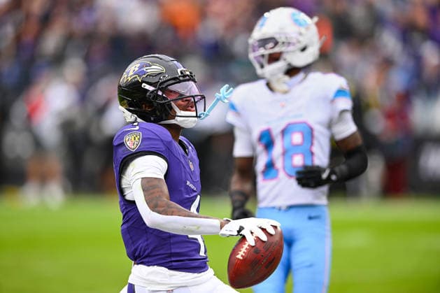 Baltimore Ravens wide receiver Zay Flowers (4) scores a touchdown after a 19 yard pass reception against the Tennessee Titans during the second quarter at M&T Bank Stadium in Baltimore, Maryland, on Sunday, October 4, 2026.  BAL20261004126 DAVIDxTULIS