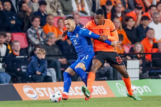 EINDHOVEN, NETHERLANDS - OCTOBER 4: Filip Kostic of Serbia battles for the ball with Denzel Dumfries of Netherlands during the UEFA Nations League 2026 27 Group A2 MD4 match between Netherlands and Serbia at Philips Stadion on October 04, 2026 in Eindhoven, Netherlands.  Copyright: xDijksxMedia MBxMediax