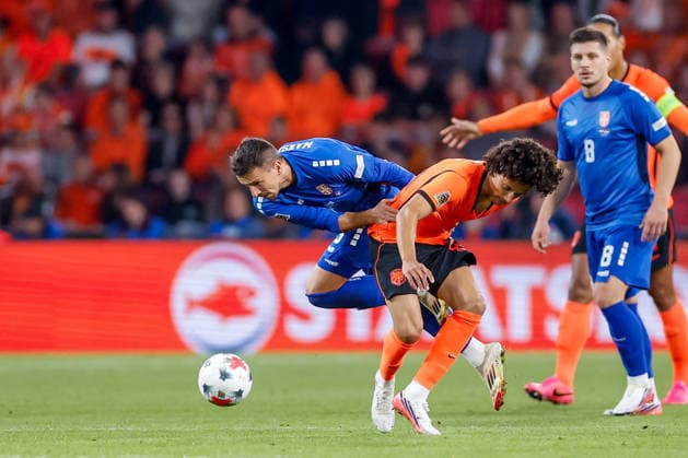EINDHOVEN, NETHERLANDS - OCTOBER 4: Gjivai Zechiel of Netherlands battles for the ball with Nemanja Maksimovic of Serbia during the UEFA Nations League 2026 27 Group A2 MD4 match between Netherlands and Serbia at Philips Stadion on October 04, 2026 in Eindhoven, Netherlands.  Copyright: xDijksxMedia MBxMediax