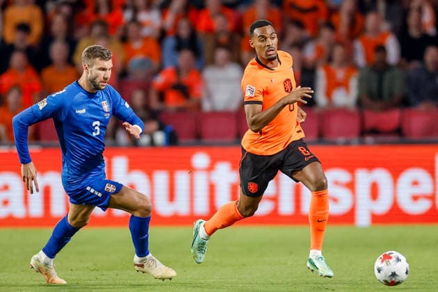 EINDHOVEN, NETHERLANDS - OCTOBER 4: Ryan Gravenberch of Netherlands is challenged by Strahinja Pavlovic of Serbia during the UEFA Nations League 2026 27 Group A2 MD4 match between Netherlands and Serbia at Philips Stadion on October 04, 2026 in Eindhoven, Netherlands.  Copyright: xDijksxMedia MBxMediax