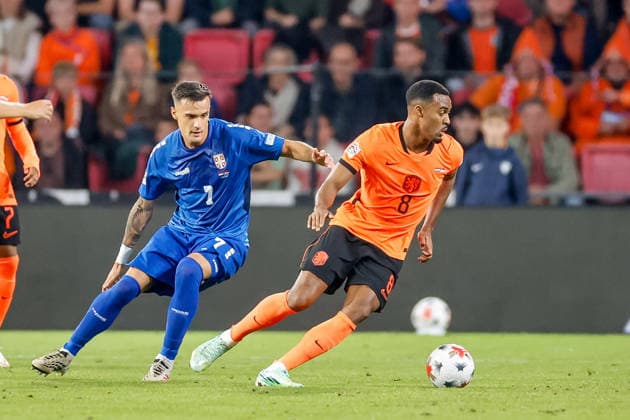 EINDHOVEN, NETHERLANDS - OCTOBER 4: Ryan Gravenberch of Netherlands is challenged by Aleksandar Stankovic of Serbia during the UEFA Nations League 2026 27 Group A2 MD4 match between Netherlands and Serbia at Philips Stadion on October 04, 2026 in Eindhoven, Netherlands.  Copyright: xDijksxMedia MBxMediax