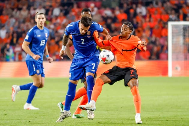 EINDHOVEN, NETHERLANDS - OCTOBER 4: Crysencio Summerville of Netherlands battles for the ball with Aleksandar Stankovic of Serbia during the UEFA Nations League 2026 27 Group A2 MD4 match between Netherlands and Serbia at Philips Stadion on October 04, 2026 in Eindhoven, Netherlands.  Copyright: xDijksxMedia MBxMediax