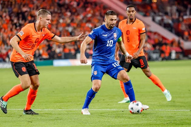 EINDHOVEN, NETHERLANDS - OCTOBER 4: Dusan Tadic of Serbia is challenged by Joey Veerman of Netherlands during the UEFA Nations League 2026 27 Group A2 MD4 match between Netherlands and Serbia at Philips Stadion on October 04, 2026 in Eindhoven, Netherlands.  Copyright: xDijksxMedia MBxMediax