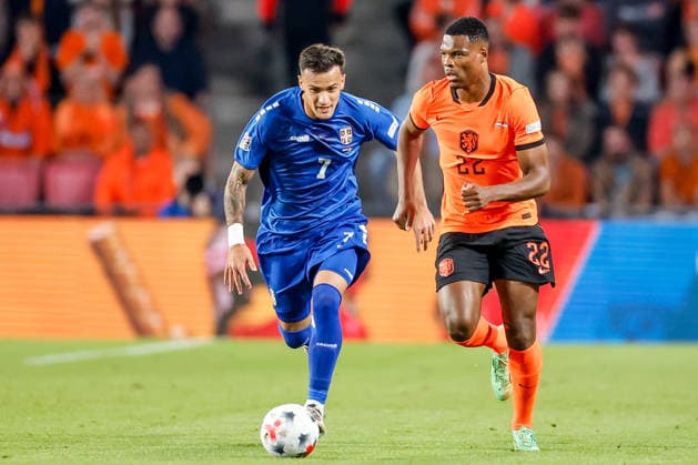 EINDHOVEN, NETHERLANDS - OCTOBER 4: Denzel Dumfries of Netherlands is challenged by Aleksandar Stankovic of Serbia. during the UEFA Nations League 2026 27 Group A2 MD4 match between Netherlands and Serbia at Philips Stadion on October 04, 2026 in Eindhoven, Netherlands.  Copyright: xDijksxMedia MBxMediax