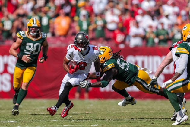 Oct 4, 2026; Tampa, FL, USA; Tampa Bay Buccaneers wide receiver Emeka Egbuka (2) attempt to avoid a tackle after catching a pass from quarterback Jalon Daniels (10) during the NFL, American Football Herren, USA game between the Green Bay Packers and Tampa Bay Buccaneers at Raymond James Stadium. Mandatory Credit: Taylor McFee-Cal Media Tampa USA - ZUMAc04_ 20261004_zma_c04_091 Copyright: xTaylorxMcfeex