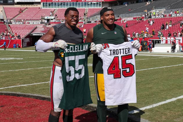 Oct 4, 2026; Tampa, FL, USA; Tampa Bay Buccaneers linebacker Josiah Trotter (45) and Green Bay Packers defensive tackle Chris McClellan (55) swap jerseys after the NFL, American Football Herren, USA game between the Green Bay Packers and Tampa Bay Buccaneers at Raymond James Stadium. The Green Bay Packers defeated the Tampa Bay Buccaneers 17-14. Mandatory Credit: Taylor McFee-Cal Media Tampa USA - ZUMAc04_ 20261004_zma_c04_102 Copyright: xTaylorxMcfeex