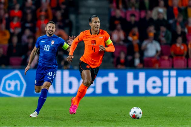 EINDHOVEN l Serbia forward Dusan Tadic and Netherlands defender Virgil van Dijk during the UEFA Nations League match between the Netherlands and Serbia at Philips Stadion on October 4, 2026, in Eindhoven, Netherlands. Photo by DeFodi Images