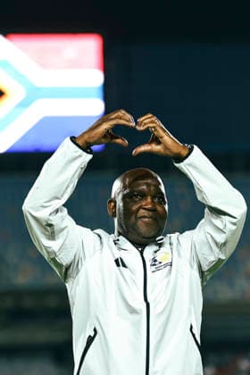 Cairo Egypt South Africa Match Pitso Mosimane gestures a heart symbol toward the stands at Cairo International Stadium in Cairo, Egypt on October 4, 2026. The International Friendly, Länderspiel, Nationalmannschaft match serves as preparation for both national teams ahead of upcoming regional and continental football competitions. Cairo Cairo Egypt Copyright: xMostafaxElxShahatx