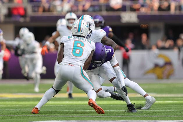 MINNEAPOLIS, MN - OCTOBER 04: Minnesota Vikings cornerback Zemaiah Vaughn (5) tackles Miami Dolphins wide receiver Malik Washington (6) during the first half of the NFL, American Football Herren, USA game between the Miami Dolphins and the Minnesota Vikings on October 4th, 2026, at U.S. Bank Stadium in Minneapolis, MN. (Photo by Bailey Hillesheim Icon Sportswire) NFL: OCT 04 Dolphins at Vikings EDITORIAL USE ONLY Icon20261004019