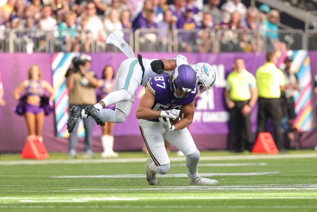 MINNEAPOLIS, MN - OCTOBER 04: Miami Dolphins safety Dante Trader Jr. (11) tackles Minnesota Vikings tight end T.J. Hockenson (87) during the first half of the NFL, American Football Herren, USA game between the Miami Dolphins and the Minnesota Vikings on October 4th, 2026, at U.S. Bank Stadium in Minneapolis, MN. (Photo by Bailey Hillesheim Icon Sportswire) NFL: OCT 04 Dolphins at Vikings EDITORIAL USE ONLY Icon20261004025