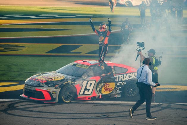 LAS VEGAS, NV - OCTOBER 04: Chase Briscoe ( 19 Joe Gibbs Racing Bass Pro Shops Toyota) climbs on his car to celebrate winning the race during the NASCAR, Motorsport, USA Cup Series Playoffs South Point 400 on October 04, 2026, at Las Vegas Motor Speedway in Las Vegas, NV. (Photo by Chris Williams LVMS Icon Sportswire) AUTO: OCT 04 NASCAR Cup Series Playoffs South Point 400 EDITORIAL USE ONLY Icon0072610041251