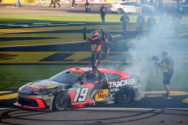 LAS VEGAS, NV - OCTOBER 04: Chase Briscoe ( 19 Joe Gibbs Racing Bass Pro Shops Toyota) climbs on his car to celebrate winning the race during the NASCAR, Motorsport, USA Cup Series Playoffs South Point 400 on October 04, 2026, at Las Vegas Motor Speedway in Las Vegas, NV. (Photo by Chris Williams LVMS Icon Sportswire) AUTO: OCT 04 NASCAR Cup Series Playoffs South Point 400 EDITORIAL USE ONLY Icon0072610041254