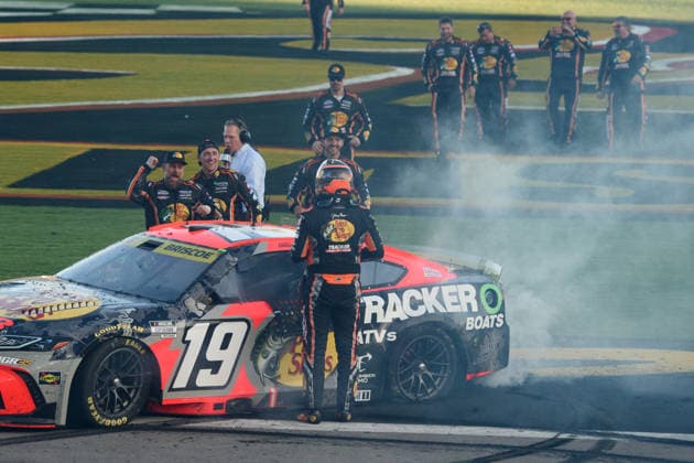 LAS VEGAS, NV - OCTOBER 04: Chase Briscoe ( 19 Joe Gibbs Racing Bass Pro Shops Toyota) celebrates winning race with his team during the NASCAR, Motorsport, USA Cup Series Playoffs South Point 400 on October 04, 2026, at Las Vegas Motor Speedway in Las Vegas, NV. (Photo by Chris Williams LVMS Icon Sportswire) AUTO: OCT 04 NASCAR Cup Series Playoffs South Point 400 EDITORIAL USE ONLY Icon0072610041257