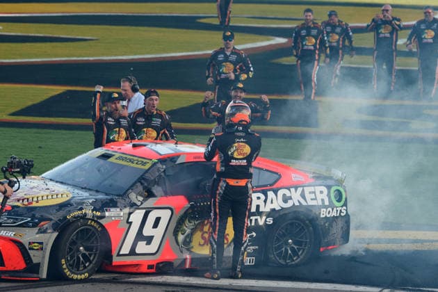 LAS VEGAS, NV - OCTOBER 04: Chase Briscoe ( 19 Joe Gibbs Racing Bass Pro Shops Toyota) celebrates winning race with his team during the NASCAR, Motorsport, USA Cup Series Playoffs South Point 400 on October 04, 2026, at Las Vegas Motor Speedway in Las Vegas, NV. (Photo by Chris Williams LVMS Icon Sportswire) AUTO: OCT 04 NASCAR Cup Series Playoffs South Point 400 EDITORIAL USE ONLY Icon0072610041258